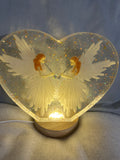 Large clear resin heart with white angels and lighted